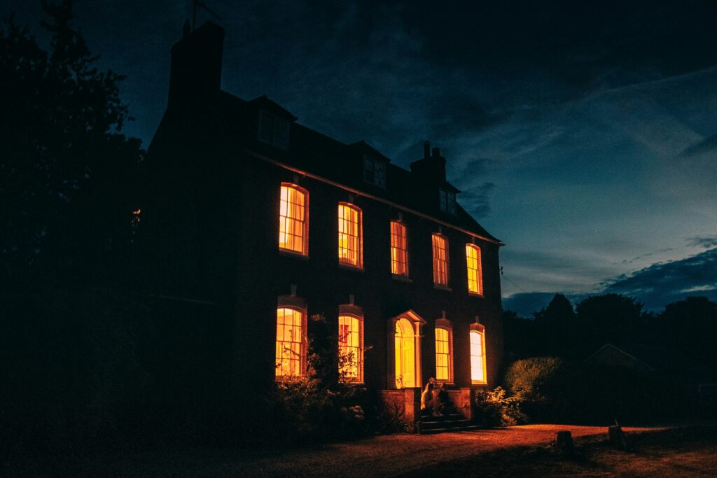 An eerie looking house at night.
